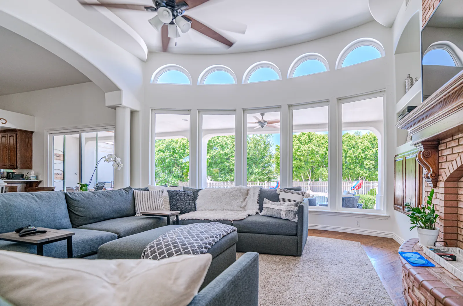 Living area with a row of windows and arched clerestory glass