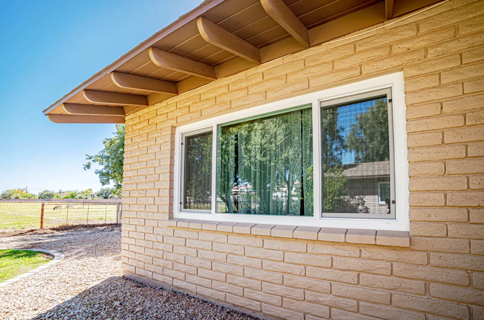 White replacement window installed in a masonry opening