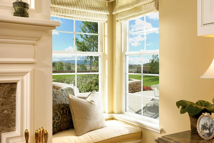 Installed Anlin Catalina corner windows above a built-in window seat