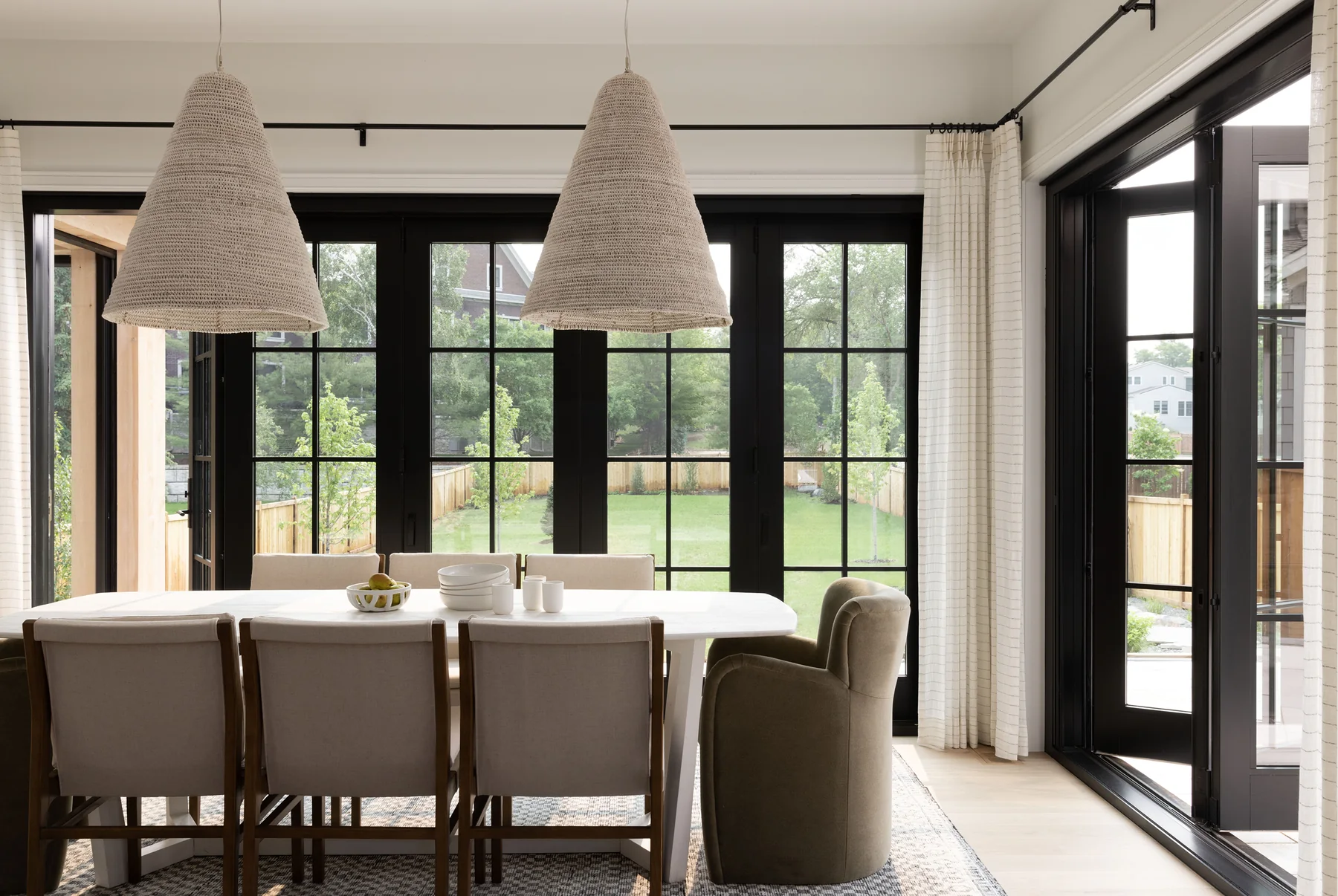 Marvin Ultimate bi-fold door connecting dining and patio spaces